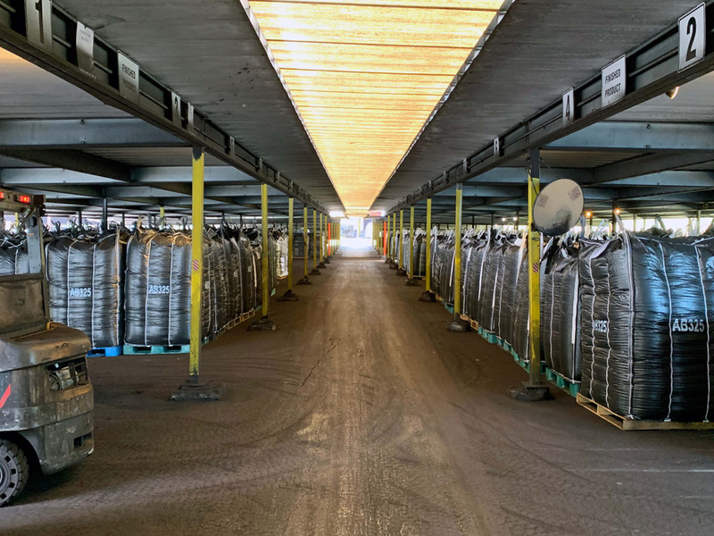 Industrial storage facility with packaged products neatly stacked in rows